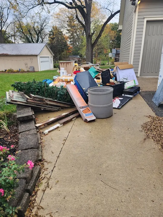 Dumpster being loaded with debris for Residential Dumpster Rental in Santa Clarita